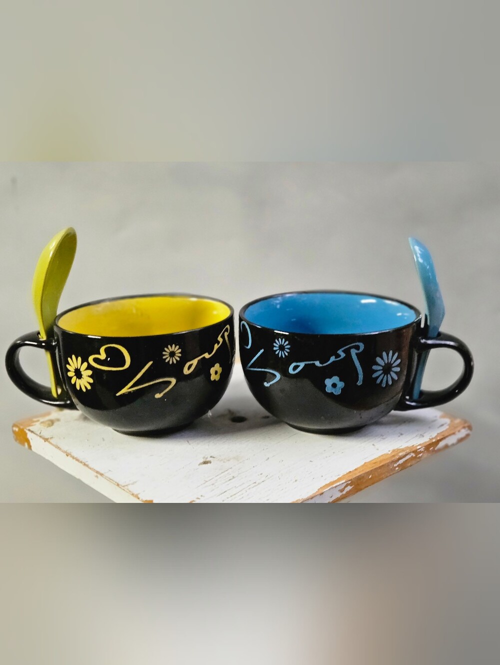 Source Unknown Black Ceramic Cups with Yellow and Blue Interiors